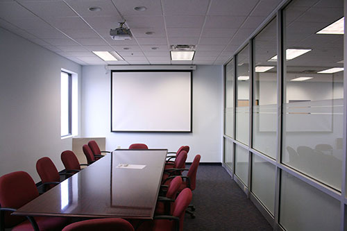 Our commercial interior renovation for PHA Body Systems' includes this modern conference room.