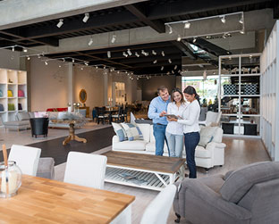 Image of two people with a commercial building contractor working on a commercial interior renovation of a pre-engineered metal building.