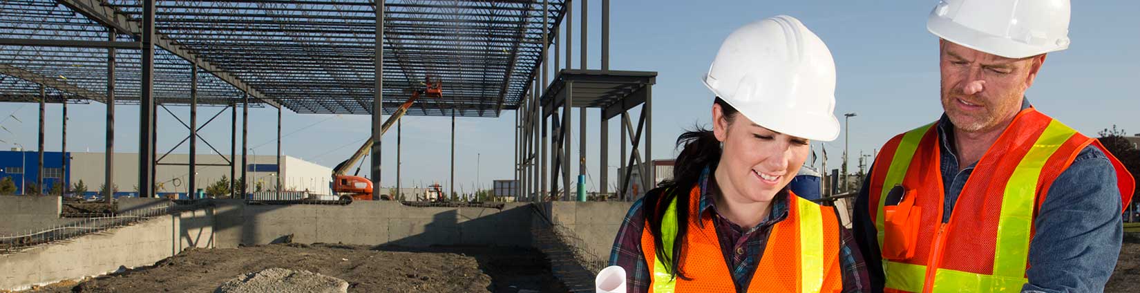 Image of 2 commercial contractors at a design & build construction site.